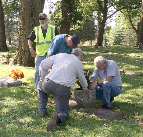 Will, two volunteers, and a cemetery employee preparing the urn at Frank and Maude's gravesite